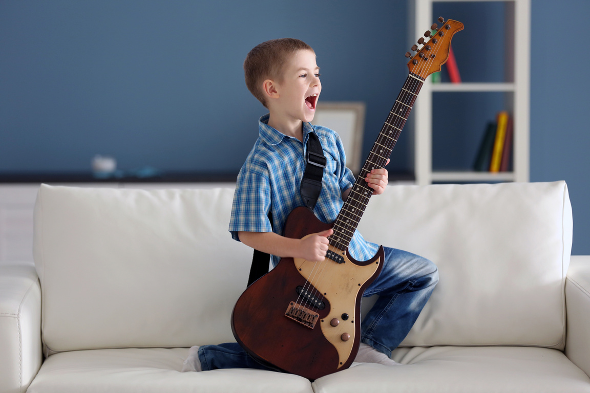 Little Boy Playing an Electric Guitar